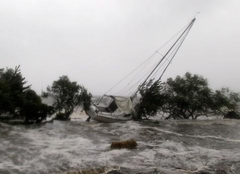 A sailboat is washed ashore as Hurricane Irene arrives on August 28, 2011 in Southampton, New York.