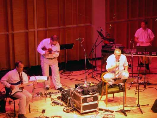The Zippo Band. Phil Kline, guitar; Todd Reynolds, violin; Theo Bleckmann, vocals; and David Cossin, percussion. Merkin Hall, 9/28/04.