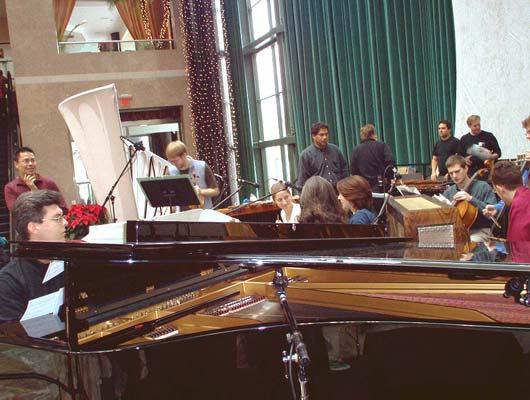 A piano's insides and members of Alarm Will Sound in rehearsal, 12/9/03.