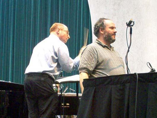 Aaron Jay Kernis (L) runs the piece, while engineer Ed Haber (R) checks microphone placement, 12/9/03.