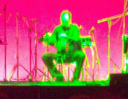 Percussionist Steven Schick (with psychedelic coloring) performs on air raid siren, from a section of John Luther Adams' 'The Mathematics of Resonant Bodies,' 11/20/03.