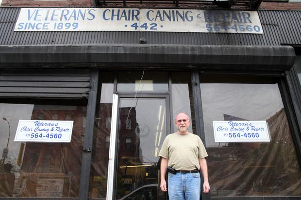 John Bausert outside his shop.