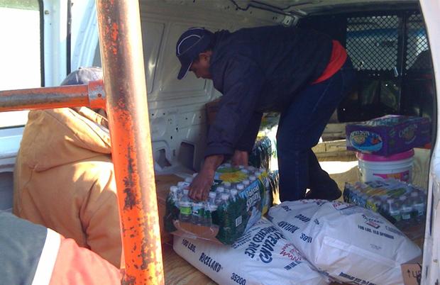 Buying bottled water for Haiti at a wholesale store in Canarsie. Buying bottled water for Haiti at a wholesale store in Canarsie.