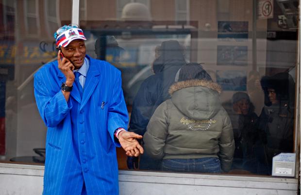 Standing outside the Haitian radio station, Radio Soleil, Jean Victor talks on the phone to his girlfriend after finally hearing from his mother in Haiti. Standing outside the Haitian radio station, Radio Soleil, Jean Victor talks on the phone to his girlfriend after finally hearing from his mother in Haiti.