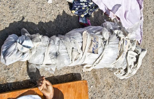 The body of five-year-old Billy Saint Hubert is wrapped in cloth in Canape Vert. The body of five-year-old Billy Saint Hubert is wrapped in cloth in Canape Vert.