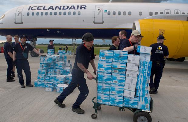 An Icelandic rescue worker unloads cases of water as they arrive at Port-au-Prince's airport on January 13. An Icelandic rescue worker unloads cases of water as they arrive at Port-au-Prince's airport on January 13.