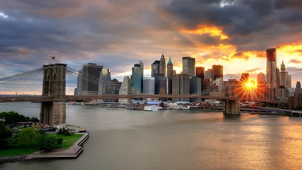 An iconic New York site: sunset over the Brooklyn Bridge An iconic New York site: sunset over the Brooklyn Bridge