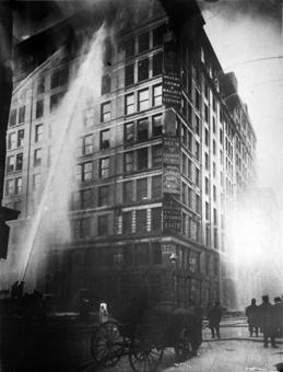 Fire fighters struggle to extinguish the burning Asch Building. Fire-quenching sprinkler systems, though proven effective, were considered too costly by many factory owners and were not installed in t