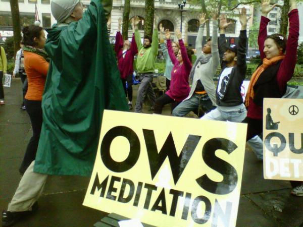 OWS takes some time to do yoga during the May Day protests.