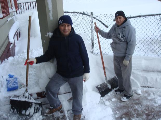 Two men clear snow from a Crown Heights walkway on January 27, 2011. Two men clear snow from a Crown Heights walkway on January 27, 2011.