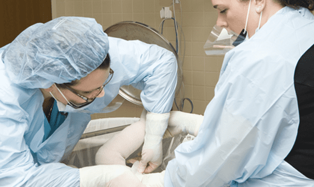 RNs Lisa Inman and Nicole Mosseau treat patients at The John A. Gannon Center for Burns and Trauma