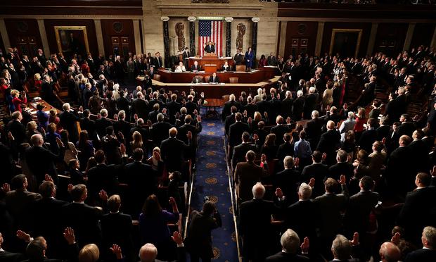 House Speaker John Boehner (R-OH) (C), swears in the newly elected members of the first session of the 113th Congress in the House Chambers January 3, 2013 in Washington, DC.