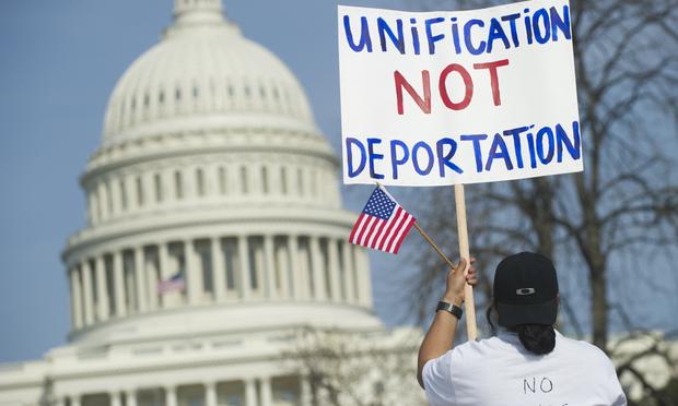 Tens of thousands of immigration reform supporters march in the 'Rally for Citizenship' on the West Lawn of the US Capitol in Washington, DC, on April 10, 2013.