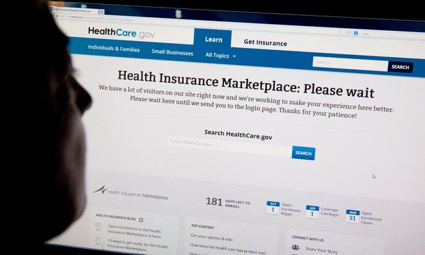 A woman looks at the HealthCare.gov insurance exchange internet site October 1, 2013 in Washington, DC.