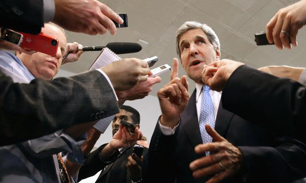 U.S. Secretary of State John Kerry speaks with reporters at the U.S. Capitol. Kerry is asking Congress not to approve any new sanctions on Iran while negotiations continue with Tehran