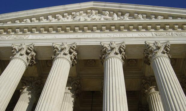 The words 'Equal Justice Under Law' are inscribed on the front of the U.S. Supreme Court.