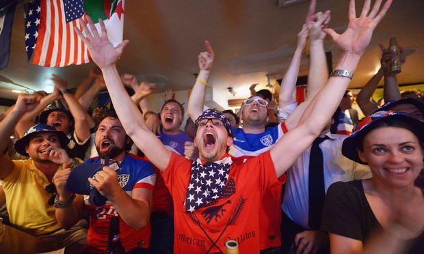 Soccer fans cheer for team U.S.A. as they face Ghana during the World Cup in Brazil at Jack Demsey's bar on June 16, 2014 in New York City.