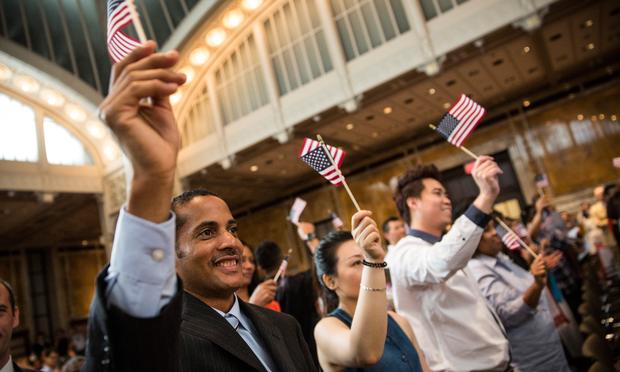 A man takes part in an United States naturalization ceremony ahead of Indepedence Day at the New York Public Library.