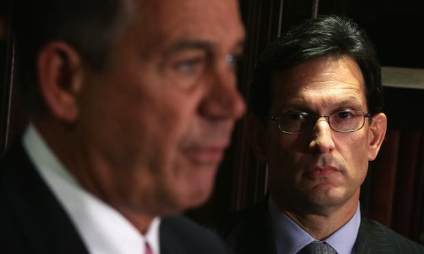 U.S. Speaker of the House Rep. John Boehner (R-OH) (L) speaks as House Majority Leader Rep. Eric Cantor (R-VA) (R) looks on during a briefing March 5, 2014.