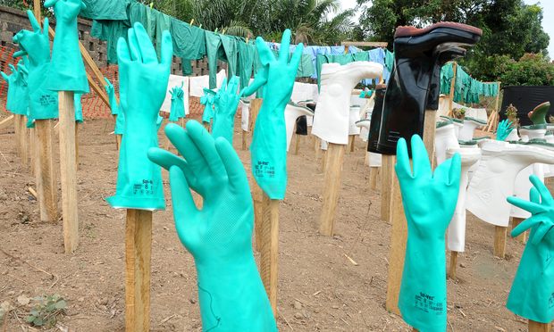 A view of gloves and boots used by medical staff, drying in the sun, at a center for victims of the Ebola virus in Guekedou, on April 1, 2014.