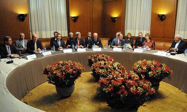 U.S. Secretary of State John Kerry sits with his fellow P5+1 foreign ministers at the UN headquarters in Geneva, after the group concluded negotiations about Iran's nuclear program. Nov 24, 2013