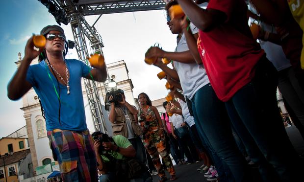 Musician Carlinhos Brown demonstrating the caxirola, Brazil's answer to the vuvuzela