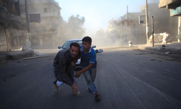 Syrian men react during a reported air strike by government forces in Aleppo on July 15, 2014. More than 170,000 people have been killed in the three-year Syrian war, one third of them civilians. Syrian men react during a reported air strike by government forces in Aleppo on July 15, 2014. More than 170,000 people have been killed in the three-year Syrian war, one third of them civilians.