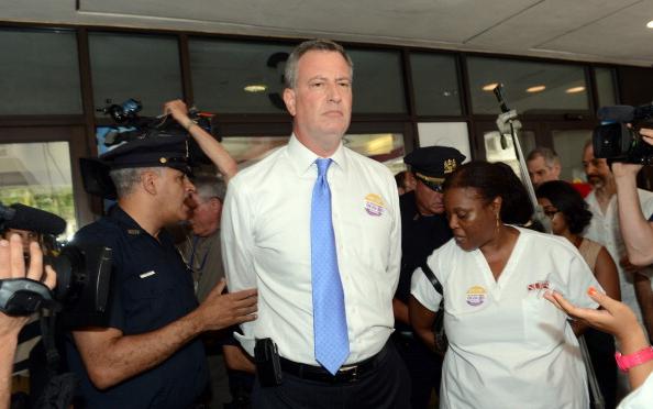 Police arrest Bill deBlasio at a July protest against a SUNY plan to close Long Island College Hospital in Brooklyn.