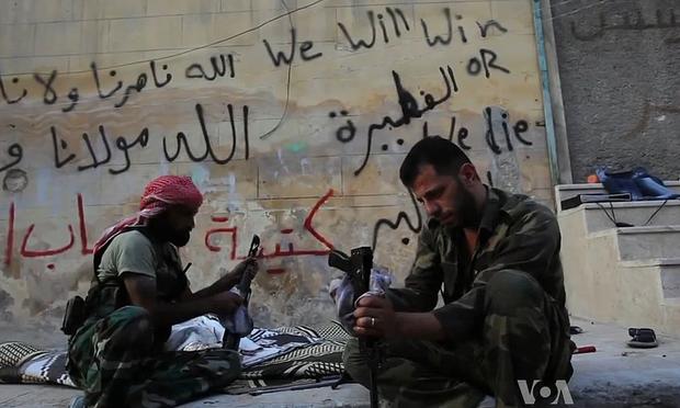 Free Syrian Army rebels cleaning their AK47s in Aleppo, Syria during the civil war. October 2012.