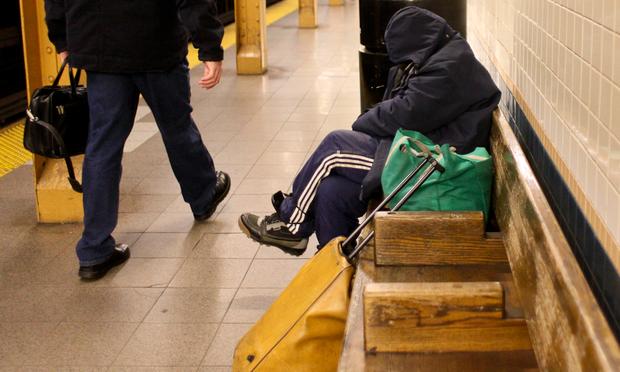 Homeless woman in Lower Manhattan subway station. Homeless woman in Lower Manhattan subway station.