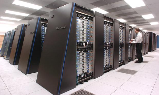 Argonne computer scientist Jonathon Anderson inspects Argonne's new IBM Blue Gene/P supercomputer, recently named the fastest computer for open science in the world (2007). IBM Blue Gene/P supercomputer