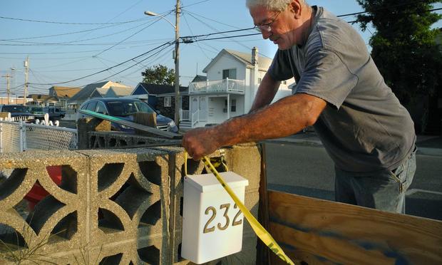 Lambros Vlachakis checking his mailbox