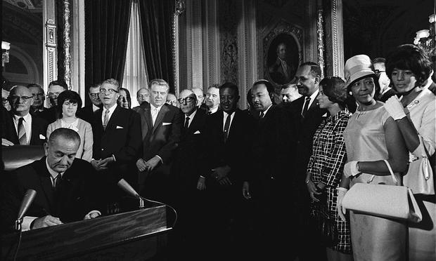 President Lyndon Johnson signs the Voting Rights Act in 1965.