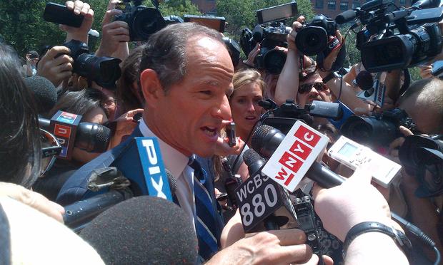 Reporters swarm former Governor Eilot Spitzer as he tries to collect petition signatures for his late entry into the city comptroller race.