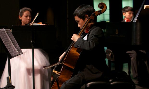 The Brioso Trio featuring Hannah Ryu, violin, age 11 from Lexington, Massachusetts, Evan Hsu, cello, age 12 from Chestnut Hill, Massachusetts, and Andrew Li, piano, age 13 from Lexington, Massachusett