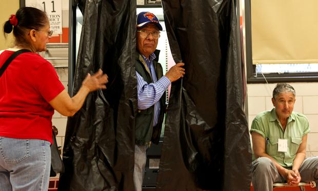 Voters in Jamaica, Queens casting ballots in the 2013 primary election. Voters in Jamaica, Queens casting ballots in the 2013 primary election.