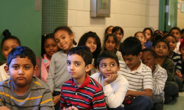 Children at P.S. 161 Arthur Ashe in Queens, recipient of a $100,000 grant, wait to enter the lunchroom.