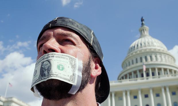A man protesting the government shutdown outside the Capitol building in Washington, DC