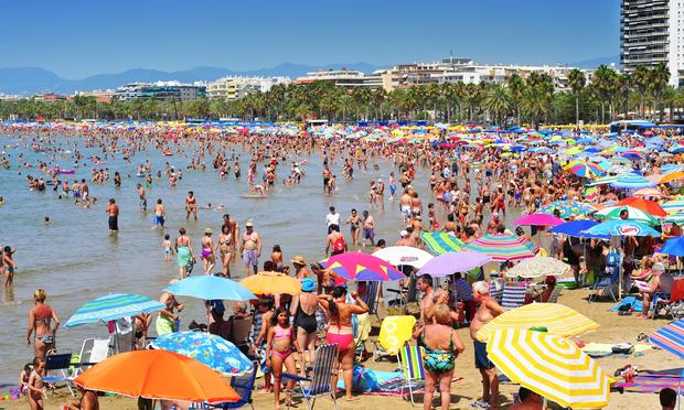 Exposure to the sun can damage skin over time. It's a good idea to use sunscreen and find some shade at the beach. beach summer beach umbrellas