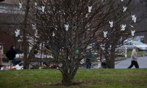 Angels hang from a tree outside of St. Rose Church in Newtown, Conn., after the deadly shooting at nearby Sandyhook Elementary School. Angels hang from a tree outside of St. Rose Church in Newtown, Conn., after the deadly shooting at nearby Sandyhook Elementary School.