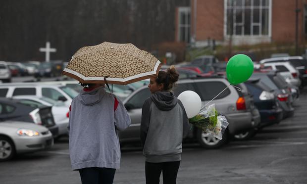 Families visit St. Rose church in Newtown, Conn., for Sunday mass, just two days after a deadly shooting at nearby Sandyhook Elementary School. Families visit St. Rose church in Newtown, Conn., for Sunday mass, just two days after a deadly shooting at nearby Sandyhook Elementary School.