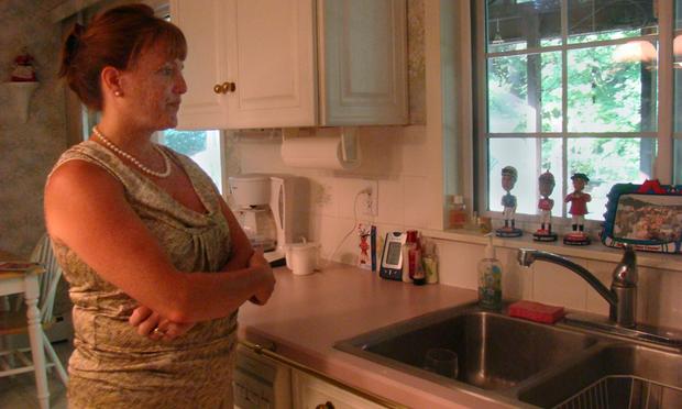 Melissa Ehler in the kitchen of the house she grew up in, which she and her husband bought from her parents in 2001.
