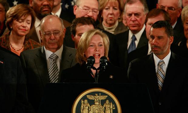 Kirsten Gillibrand (C) speaks as New York Gov. David A. Paterson (R) and former Sen. Al D'Amato look as she is annoucned to be Paterson's choice to fill NY's vacant Senate seat in Jan. 2009.