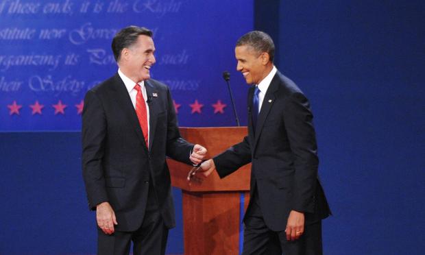 US President Barack Obama and Republican presidential candidate Mitt Romney share a laugh October 3, 2012 at the conclusion of the first presidential debate.