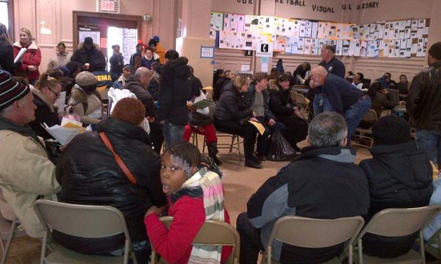 Residents seeking assistance sit and wait their turn at the Coney Island Restoration Center