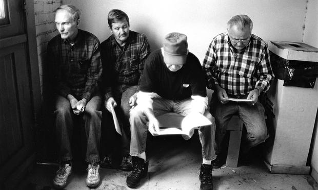 Workers with their pension papers