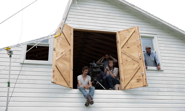 Actor John Hawkes (L) as 'Patrick' and writer/director Sean Durkin (2nd from L) on the set of 'Martha Marcy May Marlene.'