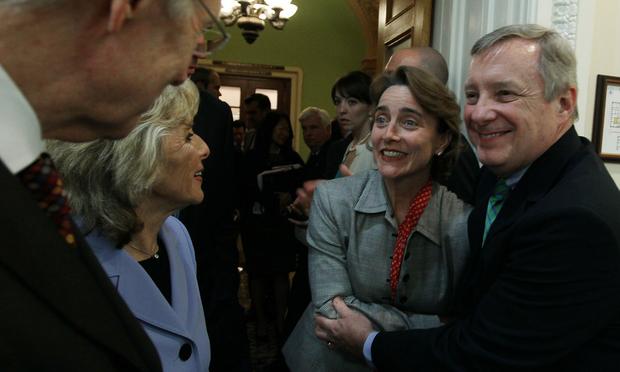 Sen. Richard Durbin (D-IL) hugs Sen. Blanche Lincoln (D-AK)as Sen. Barbara Boxer (D-CA) and Senate Majority Leader Harry Reid (D-NV) stand nearby after voting to pass Wall Street reform, May 20, 2010.