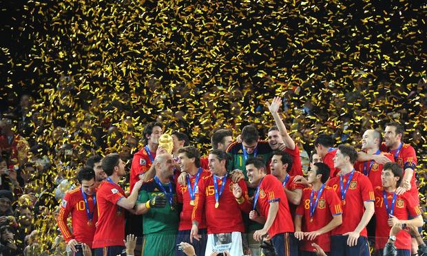 Spanish players celebrate with the trophy after the ceremony following the 2010 FIFA World Cup between the Netherlands and Spain on July 11, 2010 at Soccer City stadium in Soweto, South Africa.