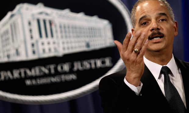 U.S. Attorney General Eric Holder holds a news conference with other officials from the Financial Fraud Enforcement Task Force to announce the results to date of 'Operation Broken Trust.'